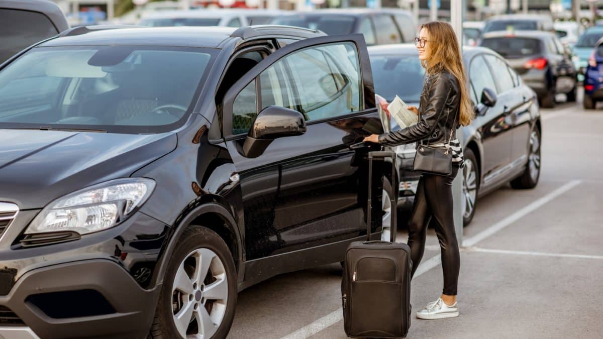 Woman renting a car